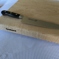 Misono molybdenum 440 series gyuto chief's knife 180 mm with Treeboard cutting board.