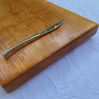 Large black cherry serving board and cutting board or cheese board by Treeboard with knife.