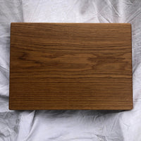 Our biggest chopping block yet is hewn from a solid slab of white oak and finished with raw linseed oil and Treeboard's exclusive board balm, made with linseed oil and carnauba wax.