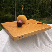 Our biggest chopping block yet is hewn from a solid slab of white oak and finished with raw linseed oil and Treeboard's exclusive board balm, made with linseed oil and carnauba wax.