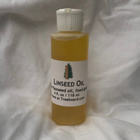 Raw linseed oil, or flaxseed oil, in bottle from Treeboard. Food grade and all natural.