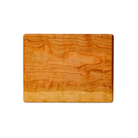 Small cherry chopping board by Treeboard. These cutting boards are organic, made of one piece of wood with no glue or petroleum products.