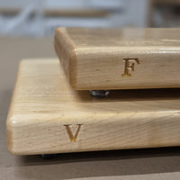 Small and medium maple cutting boards by Treeboard with engravings of V and F.