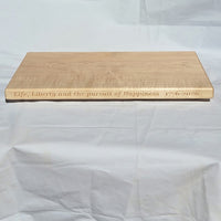 250th U.S.A. anniversary special maple cutting board by Treeboard with quotation from the Declaration of Independence: "Life, Liberty and the pursuit of Happiness." 1776-2026