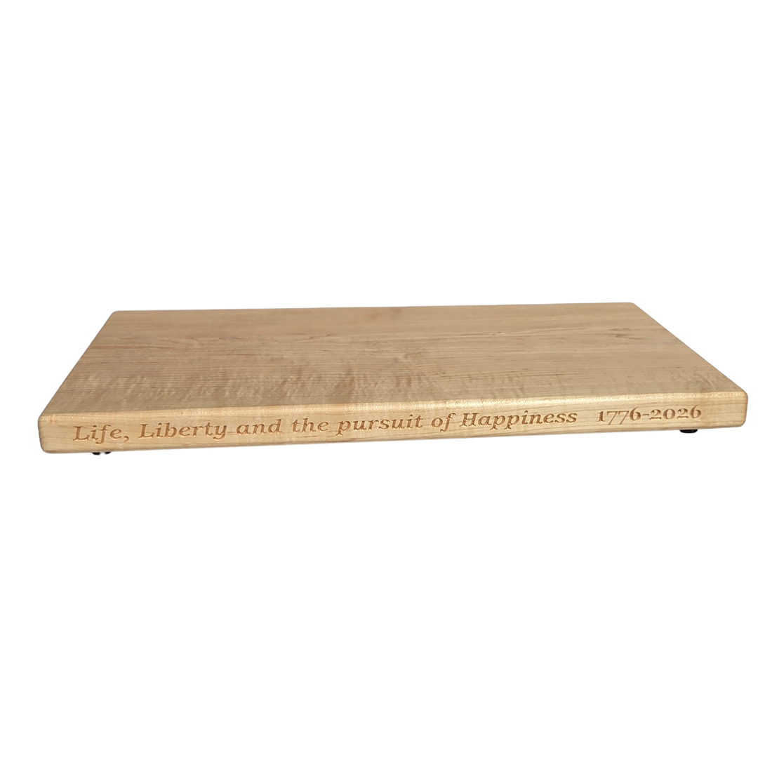 250th U.S.A. anniversary special maple cutting board by Treeboard with quotation from the Declaration of Independence: "Life, Liberty and the pursuit of Happiness." 1776-2026