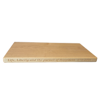 250th U.S.A. anniversary special maple cutting board by Treeboard with quotation from the Declaration of Independence: "Life, Liberty and the pursuit of Happiness." 1776-2026