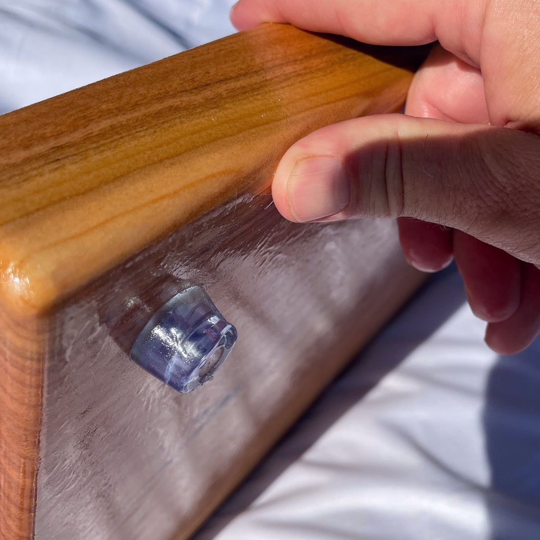 Large black cherry serving board and cutting board or cheese board by Treeboard with silicone rubber feet on the bottom.