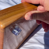 Large black cherry serving board and cutting board or cheese board by Treeboard with silicone rubber feet on the bottom.