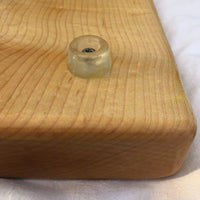 Clear rubber feet for Treeboard's hard maple cutting board, made from a solid single piece of rock-hard wood and finished with food-grade raw linseed oil and carnauba wax.