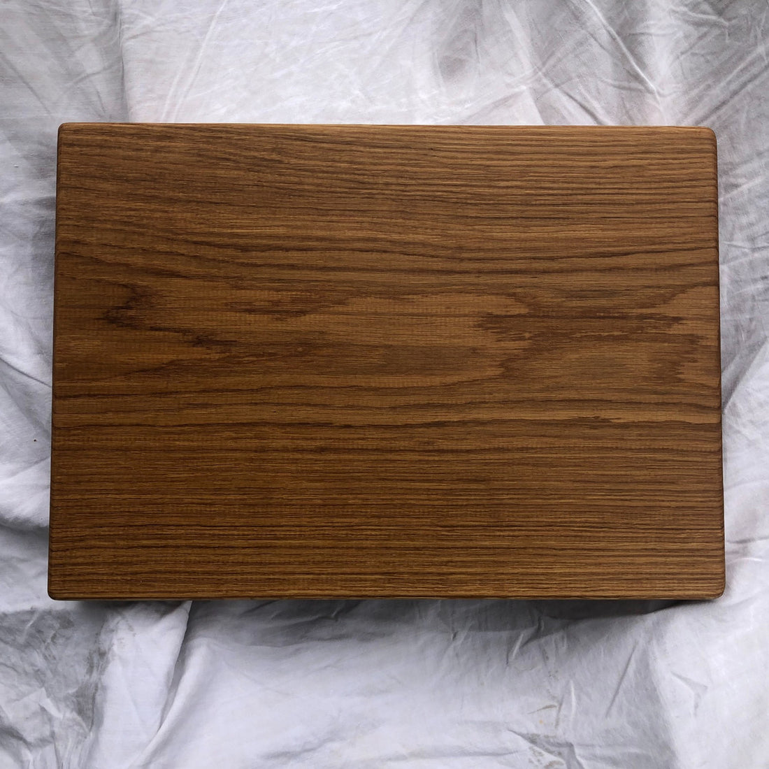Our biggest chopping block yet is hewn from a solid slab of white oak and finished with raw linseed oil and Treeboard&
