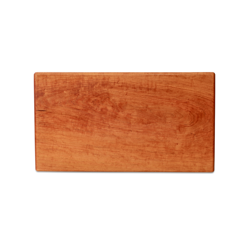 Large cherry chopping board by Treeboard. These cutting boards are organic. made of one piece of wood with no glue or petroleum products.