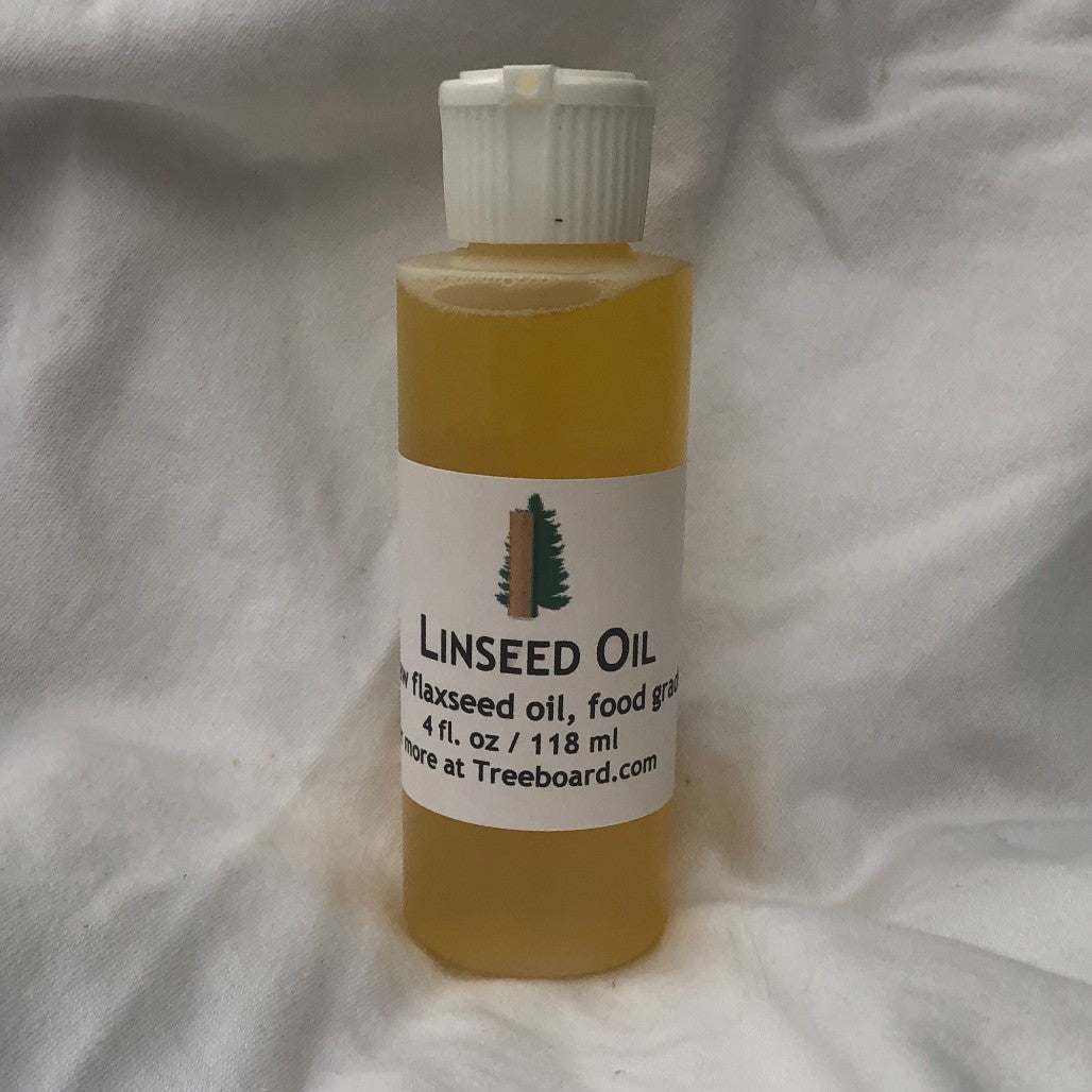 Raw linseed oil, or flaxseed oil, in bottle from Treeboard. Food grade and all natural.