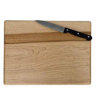 Medium maple cutting board by Treeboard with knife.