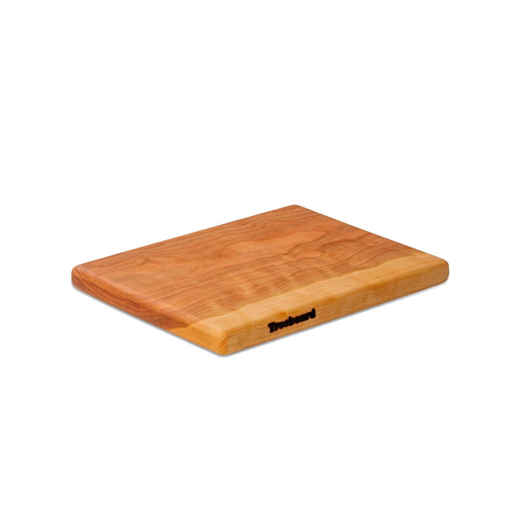 Small cherry chopping board by Treeboard. These cutting boards are organic, made of one piece of wood with no glue or petroleum products.