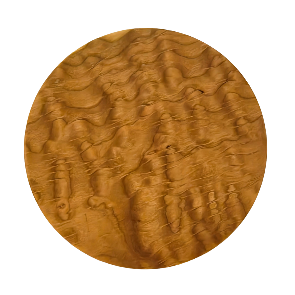Round trivet seen from above. A cherry stand for hot pans with three legs, by Treeboard. Photo shows curly cherry grain.