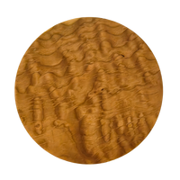 Round trivet seen from above. A cherry stand for hot pans with three legs, by Treeboard. Photo shows curly cherry grain.