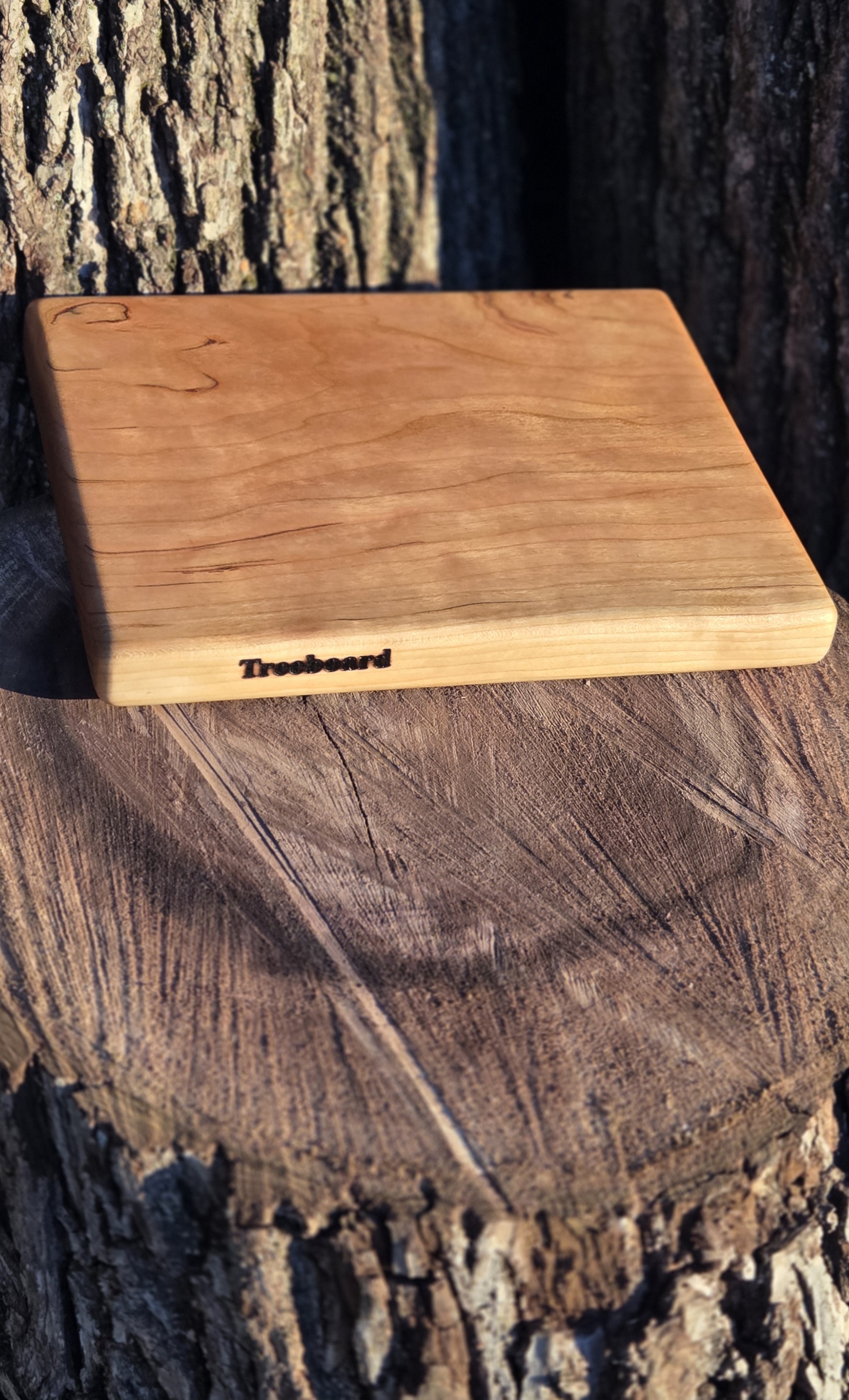Apple and squash and knife on an oak cutting board by Treeboard