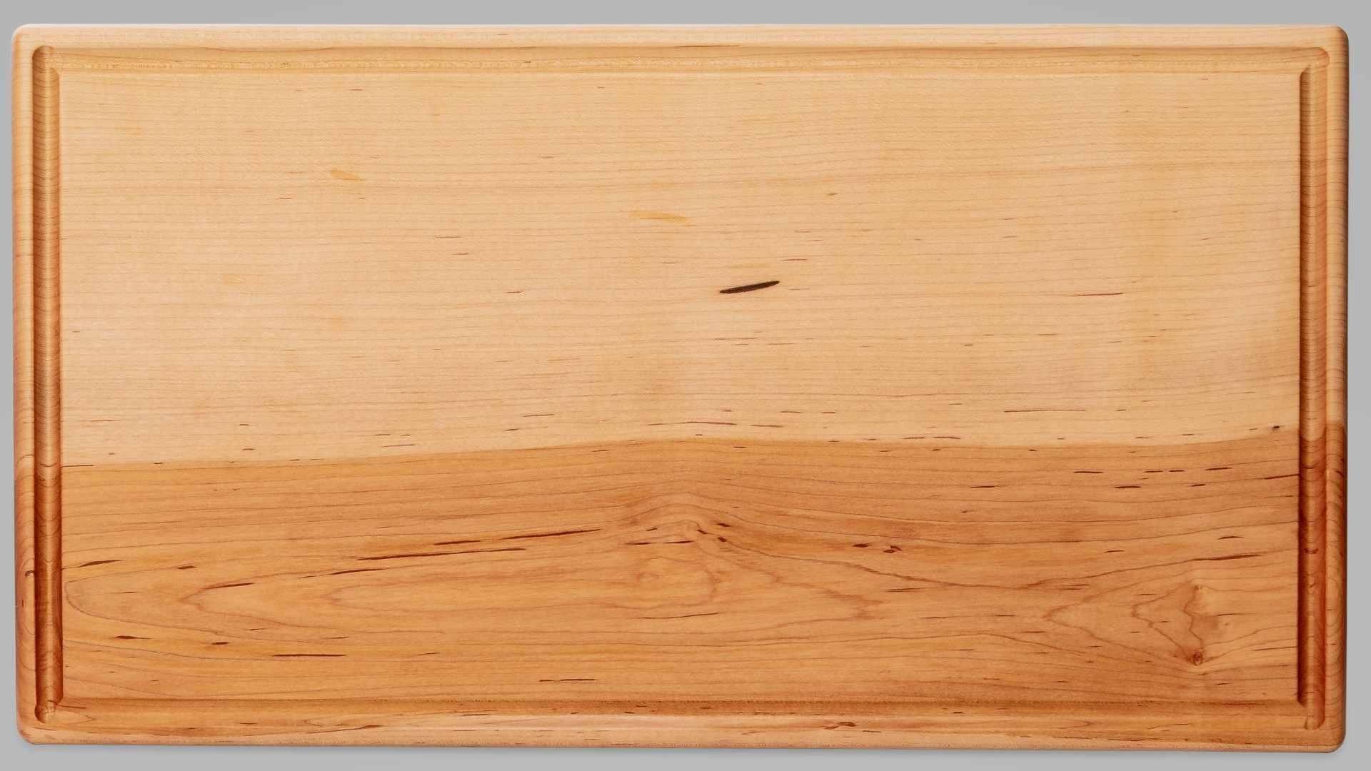 Apple and squash and knife on an oak cutting board by Treeboard