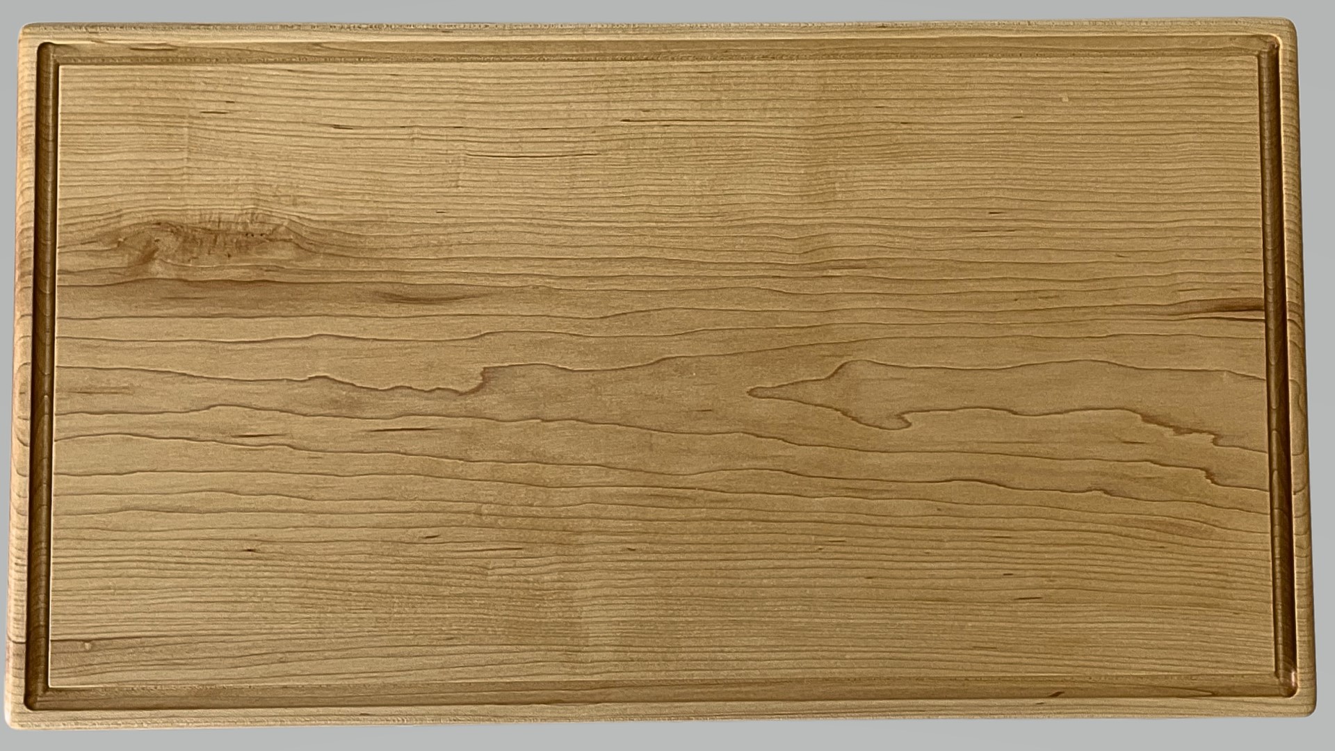 Apple and squash and knife on an oak cutting board by Treeboard